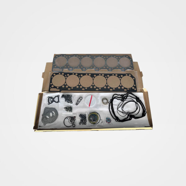 Diesel engine gasket kit in an open box featuring two six-cylinder head gaskets, rubber seals, O-rings, and assorted engine gaskets.