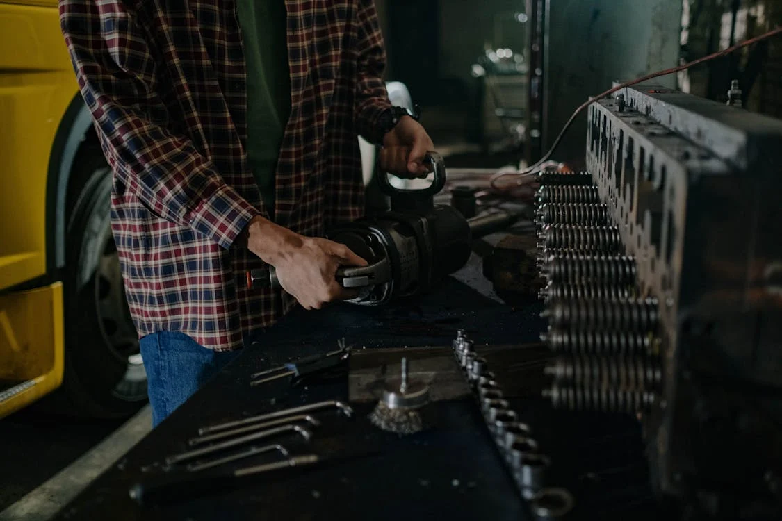 mechanic working on cylinder block