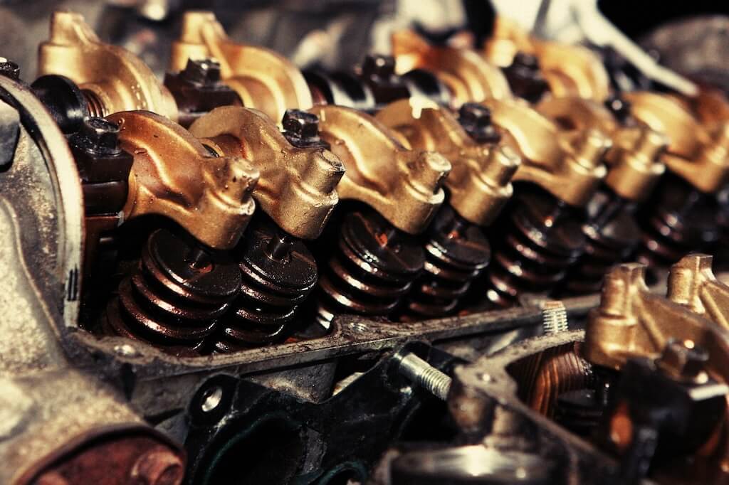 close-up of the rocker arms, valve springs, and valve stems in an engine