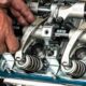 hands working on valvetrain assembly 80x80